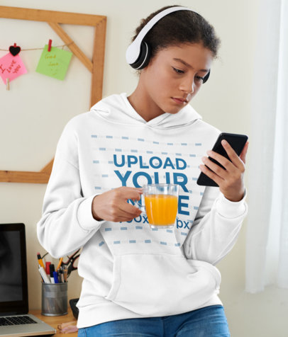 Pullover Hoodie Mockup of a Woman with Headphones Holding an Orange Juice m11582 r-el2
