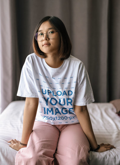 Round-Neck Tee Mockup of a Teenage Girl with Glasses in Her Bedroom