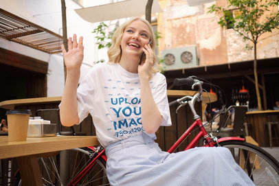 T-Shirt Mockup of a Happy Woman Talking on the Phone