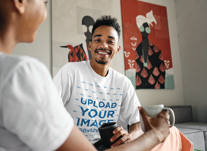 T-Shirt Mockup of a Man Having a Coffee with a Friend