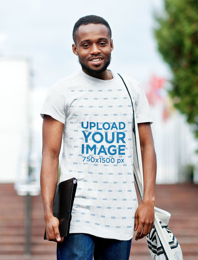 Heathered Round-Neck Tee Mockup of a Man Carrying a Binder