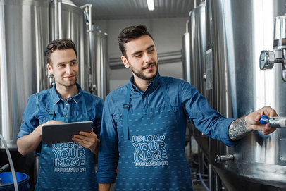 Mockup of Two Men Wearing an Apron and Checking a Brewery Machine