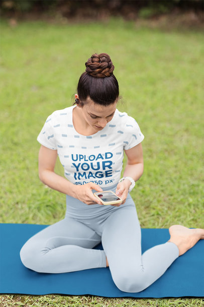 Sublimated Crop Top Mockup of a Woman Checking Her Phone Before Yoga Class