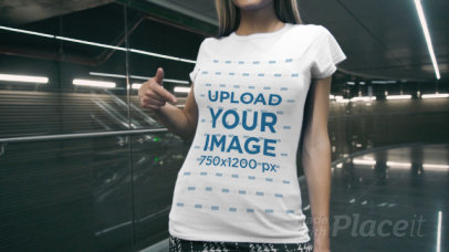 T-Shirt Video of a Playful Woman Posing Inside a Modern Building