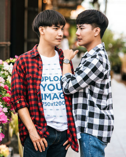 T-Shirt Mockup Featuring an LGBT Couple of Two Men Posing by a Flower Shop