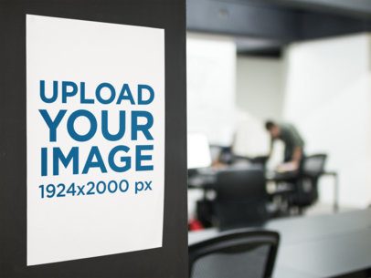 Mockup of a Poster on a Wall Near People Working