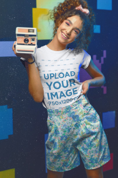 80's-Themed T-Shirt Mockup of a Woman Holding an Instant Camera