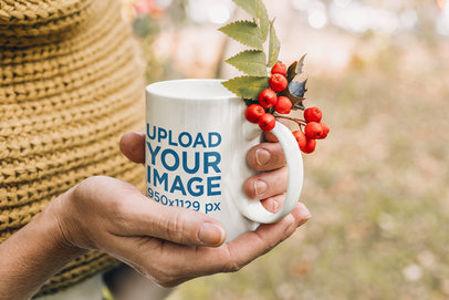 Mockup Featuring a Woman Holding an 11 oz Mug and a Mistletoe Branch m11304-r-el2