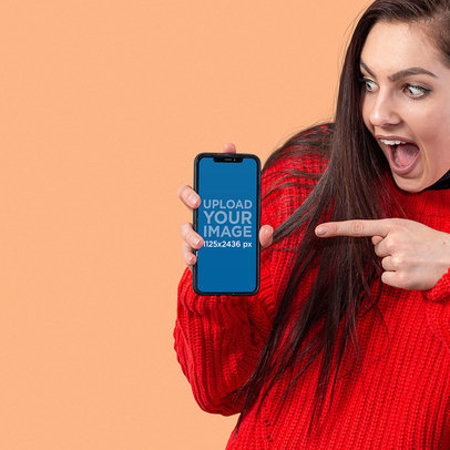 Digital Mockup of a Woman Pointing at the Screen of her iPhone 11 m11252-r-el2