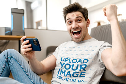 T-Shirt Mockup of a Man Playing Mobile Games