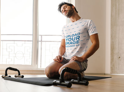 Sublimated T-Shirt Mockup of a Man Working Out at Home