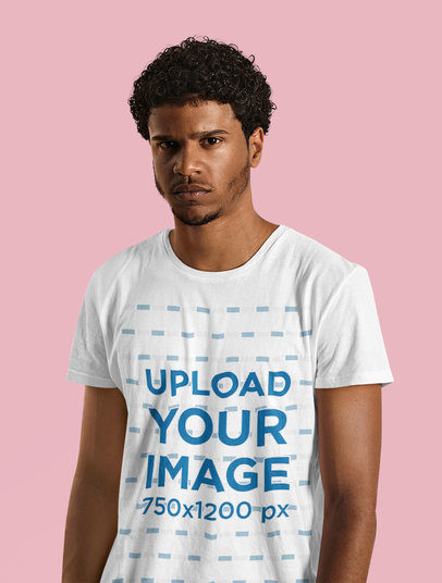 T-Shirt Mockup Featuring a Serious-Looking Man Standing at a Studio