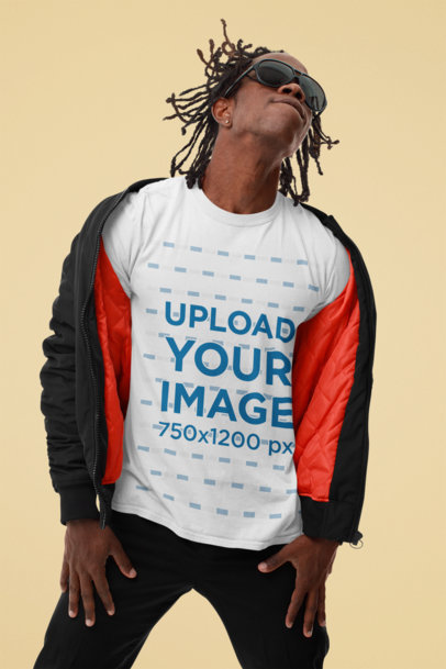 Mockup of a Man With Sunglasses Wearing a Basic T-Shirt at a Studio 