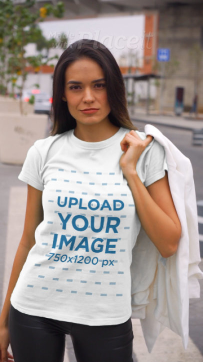 Video of a Fierce Woman Modeling a T-Shirt in the Street