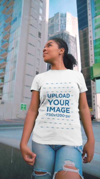 T-Shirt Video Featuring a Curly-Haired Woman in the City 