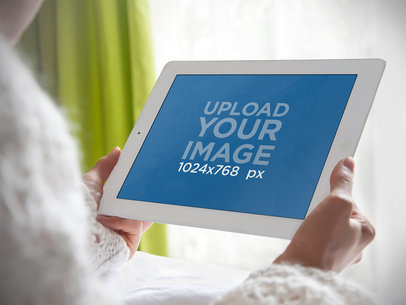 Mockup of an iPad In the Hands of a Woman