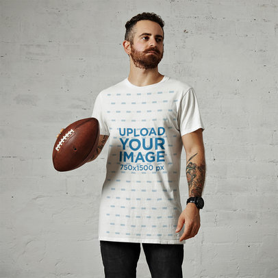 T-Shirt Mockup Featuring a Tattooed Man With a Football Ball