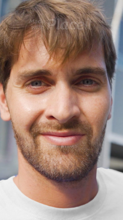 T-Shirt Video of a Man by a Building Pointing at His Garments