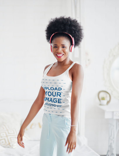Mockup of a Happy Woman in a Tank Top Wearing Headphones