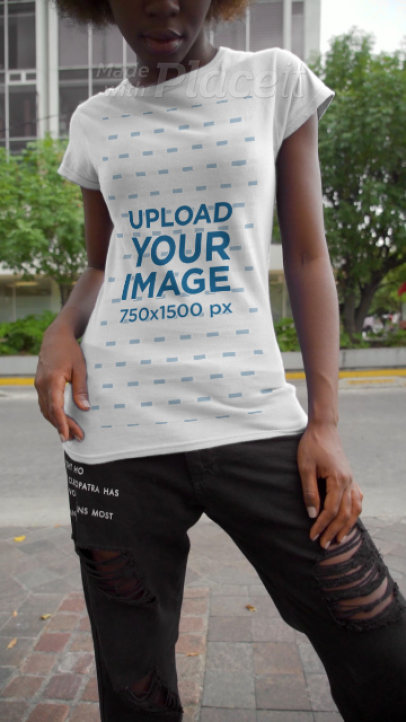Video of a Woman Modeling a T-Shirt in an Urban Scenario