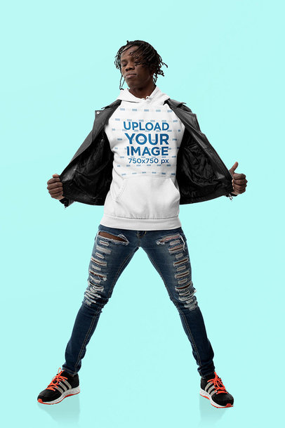 Hoodie Mockup Featuring a Confident Man Posing at a Studio 