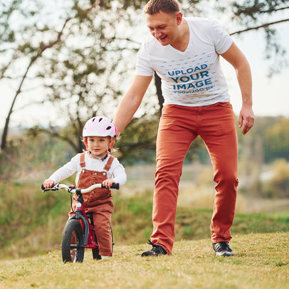 T-Shirt Mockup Featuring a Dad Teaching his Kid to Ride a Bike