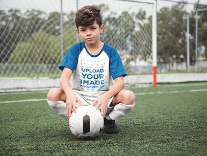 Custom Soccer Jerseys - Little Boy Squatting with the Ball at the Field a16600