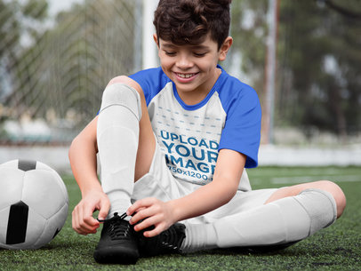 Custom Soccer Jerseys - Happy Boy Buckling His Shoes
