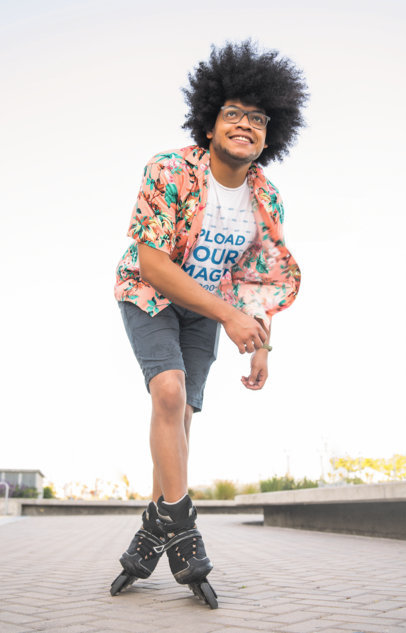 T-Shirt Mockup Featuring a Happy Man with Curly Hair Rollerskating at a Park