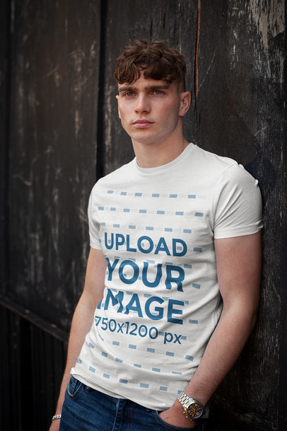 Round-Neck T-Shirt Mockup Featuring a Man Posing With a Serious Look