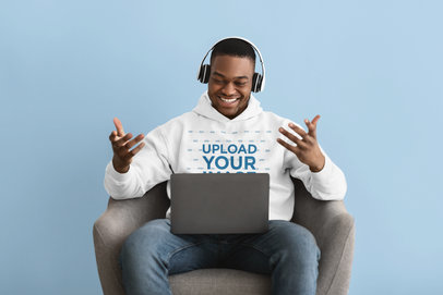 Hoodie Mockup of a Happy Man Talking on a Video Call