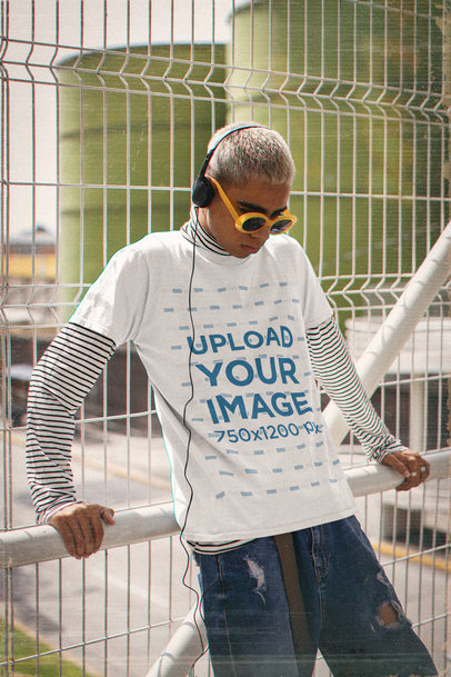Basic T-Shirt Mockup Featuring a Man in a 90s Outfit Listening to Music 