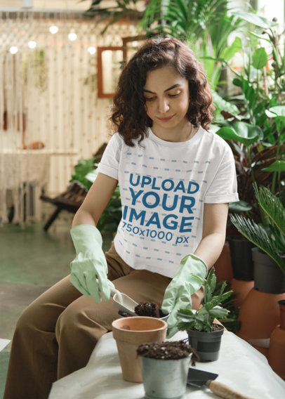Round-Neck T-Shirt Mockup Featuring a Woman Planting Flowers