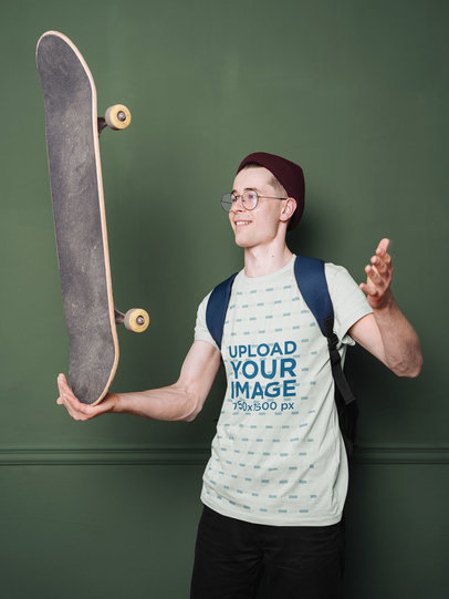 T-Shirt Mockup Featuring a Happy Man Holding a Skateboard m11661-r-el2