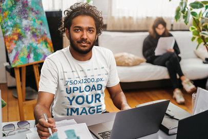 T-Shirt Mockup of an Artist Working From Home