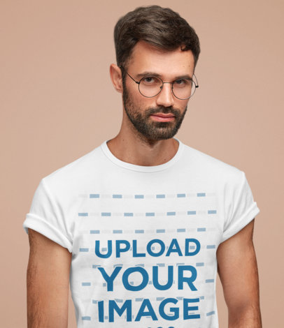 T-Shirt Mockup Featuring a Serious Man With Glasses in a Studio