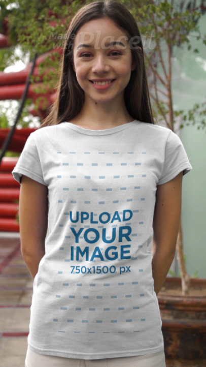 T-Shirt Video of a Woman Modeling Outside an Urban Building