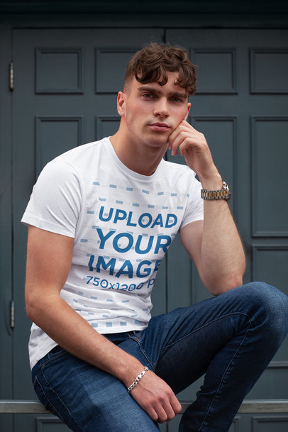 T-Shirt Mockup of a Man Posing With a Stylish Look