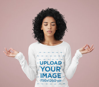 Long Sleeve Tee Mockup Featuring a Woman Meditating in a Studio