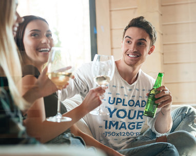 T-Shirt Mockup of a Man Drinking With Friends