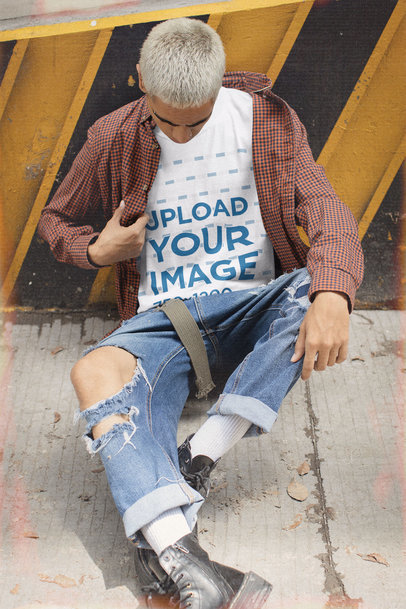 T-Shirt Mockup Featuring a Young Man with a '90s Aesthetic