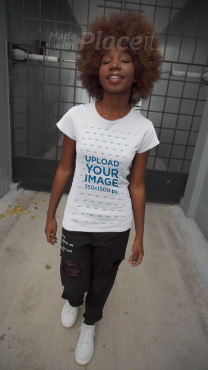 Video of a Young Woman Wearing a T-Shirt in an Urban Setting