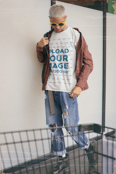 Basic T-Shirt Mockup Featuring a Young Man in a 90s Outfit 