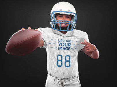 Custom Football Jerseys - Happy Player Showing the Ball