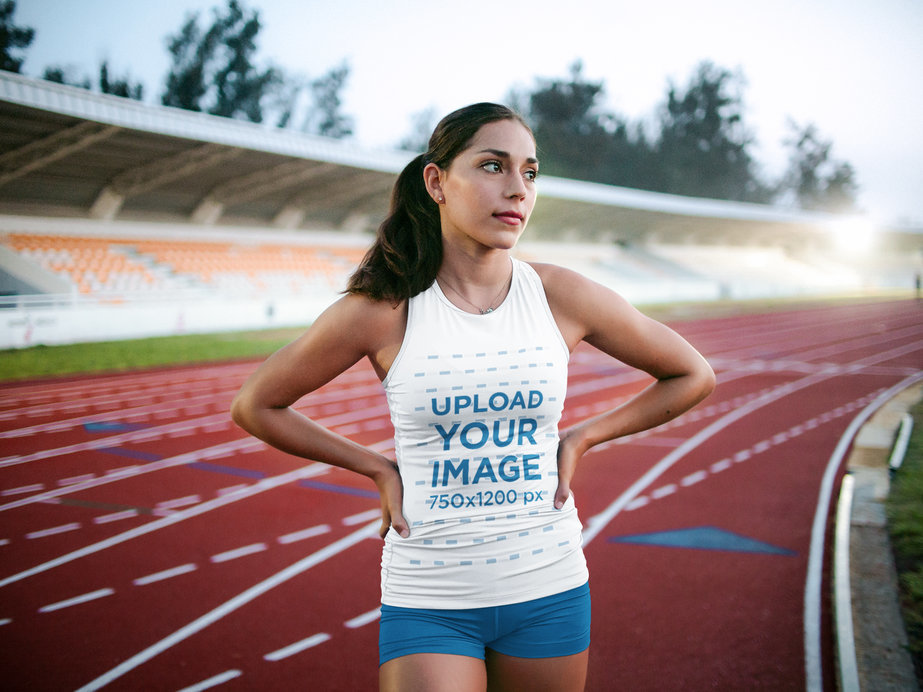 Track and Field Uniforms - Woman Standing on a Running Track