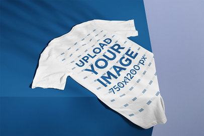 Back View Mockup of a Bella Canvas Tee Lying on the Corner of a Shelf m13433