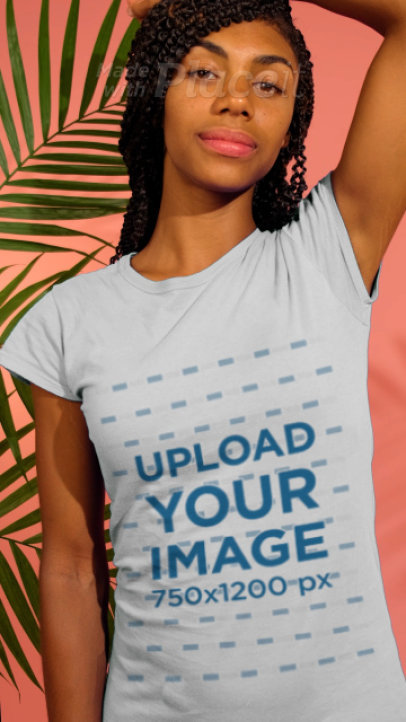T-Shirt Video Featuring a Young Woman Posing With Some Plants