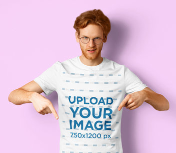 Basic T-Shirt Mockup Featuring a Man With Glasses Against a Plain Backdrop