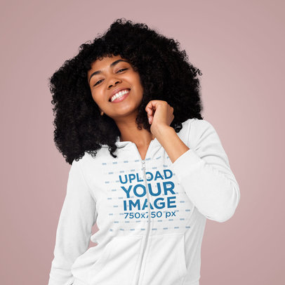 Full-Zip Hoodie Mockup Featuring a Joyful Woman With Afro Hairstyle Posing in a Studio m8808 r-el2