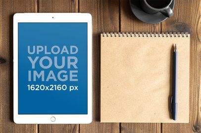iPad Mockup Featuring a Square Notebook Against a Wooden Surface m12448-r-el2